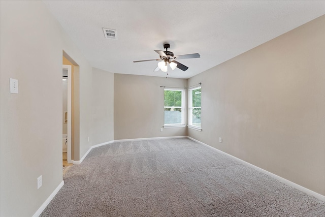 14102 Pollux Ct, Tomball, TX 77375 - spare room featuring a ceiling fan, carpet flooring, and baseboards