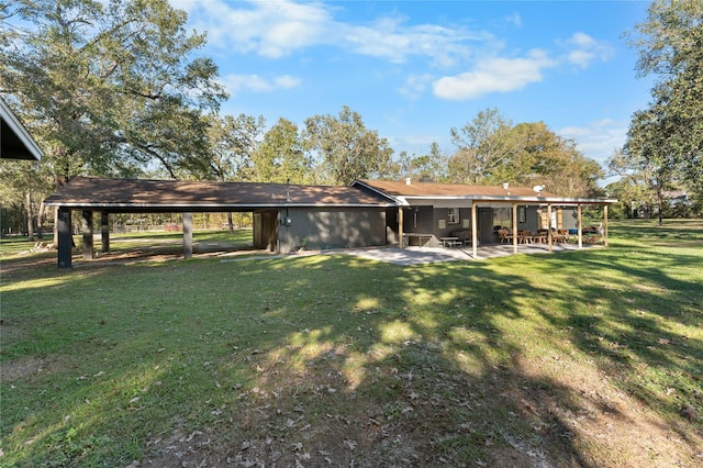 14232 Calhoun Rd, Conroe, TX 77302 - back of property featuring a patio area and a yard