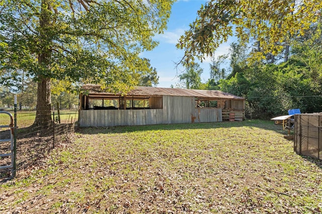 14232 Calhoun Rd, Conroe, TX 77302 - view of yard featuring an outbuilding and fence