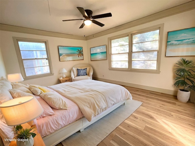 1922 14th Ave N, Texas City, TX 77590 - bedroom featuring wood finished floors, crown molding, baseboards, and ceiling fan