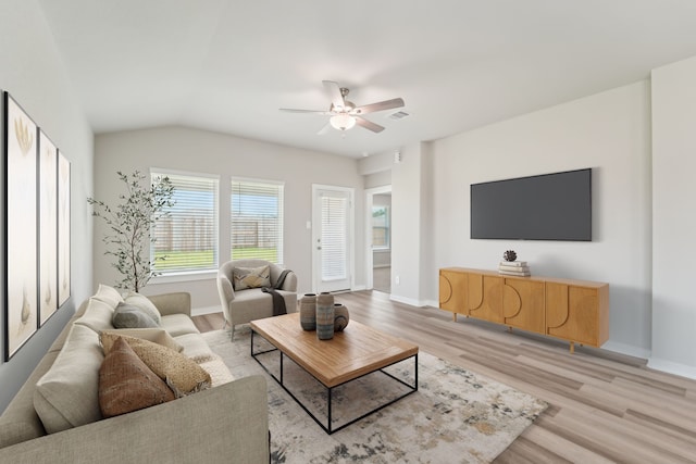 18733 Bliss Pl, New Caney, TX 77357 - living area featuring a ceiling fan, light wood-style flooring, baseboards, and vaulted ceiling