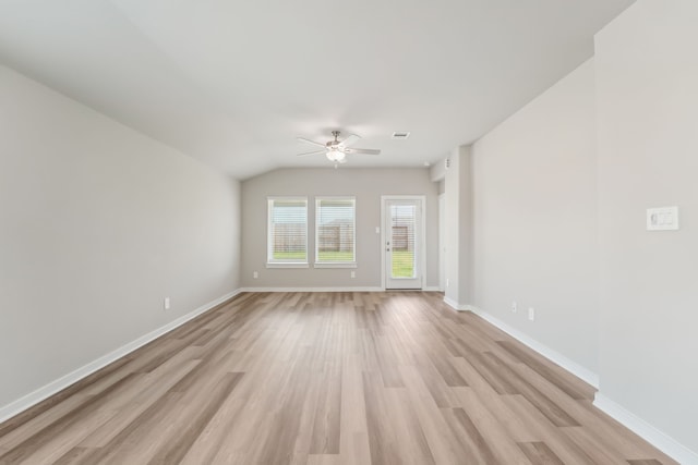 18733 Bliss Pl, New Caney, TX 77357 - spare room featuring light wood-style flooring, a ceiling fan, baseboards, and lofted ceiling