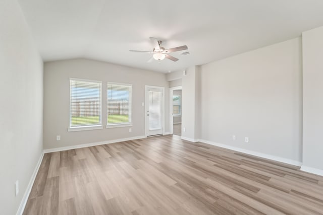 18733 Bliss Pl, New Caney, TX 77357 - spare room with a ceiling fan, light wood-type flooring, baseboards, and vaulted ceiling