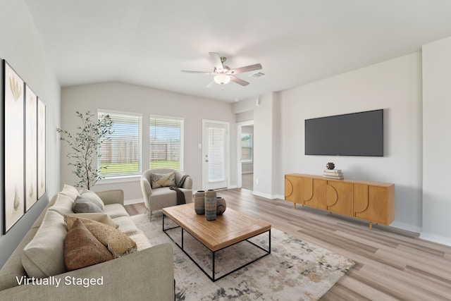 18733 Bliss Pl, New Caney, TX 77357 - living area with ceiling fan, light wood-style flooring, baseboards, and vaulted ceiling