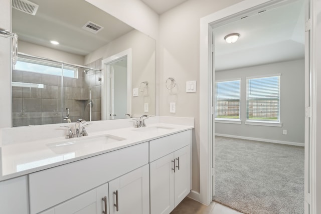 18733 Bliss Pl, New Caney, TX 77357 - full bathroom featuring double vanity, tiled shower, and baseboards