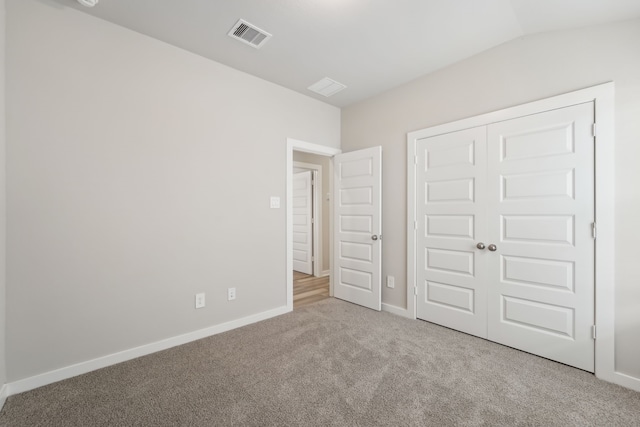18733 Bliss Pl, New Caney, TX 77357 - unfurnished bedroom featuring carpet floors, baseboards, a closet, and lofted ceiling