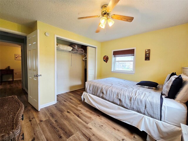 16611 Jolly Roger Rd, Jamaica Beach, TX 77554 - bedroom featuring wood finished floors, a closet, a ceiling fan, and baseboards