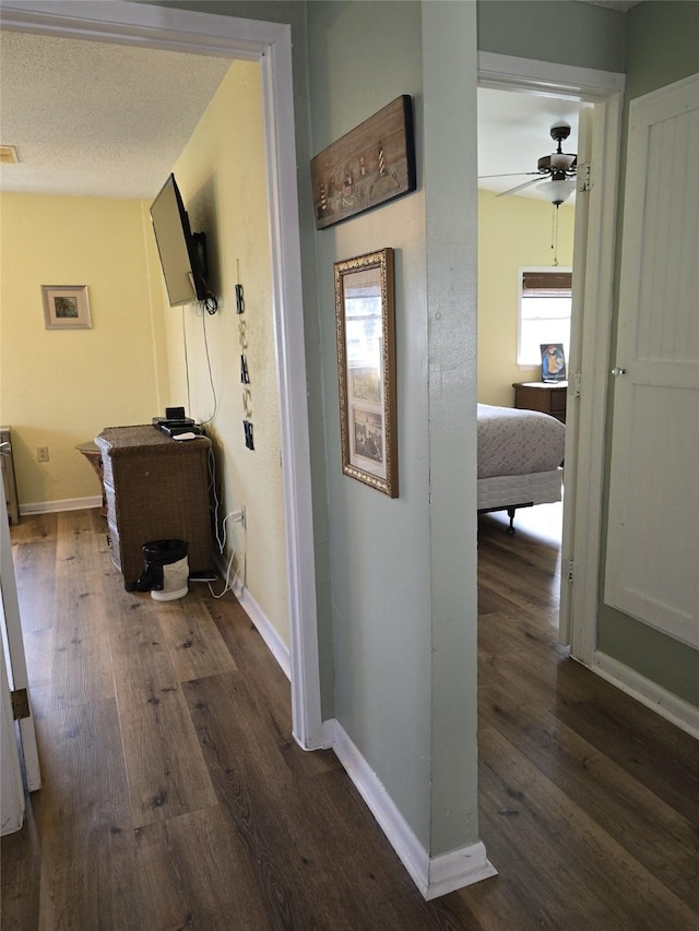 16611 Jolly Roger Rd, Jamaica Beach, TX 77554 - corridor with wood finished floors and baseboards