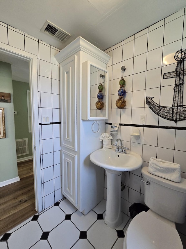 16611 Jolly Roger Rd, Jamaica Beach, TX 77554 - half bath with tile walls and toilet