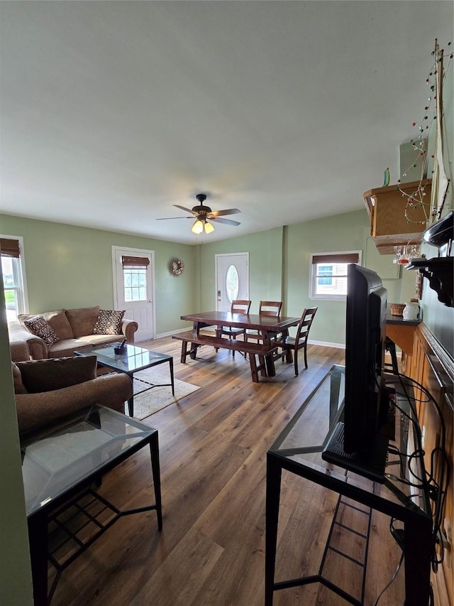 16611 Jolly Roger Rd, Jamaica Beach, TX 77554 - living room featuring wood finished floors, baseboards, and ceiling fan