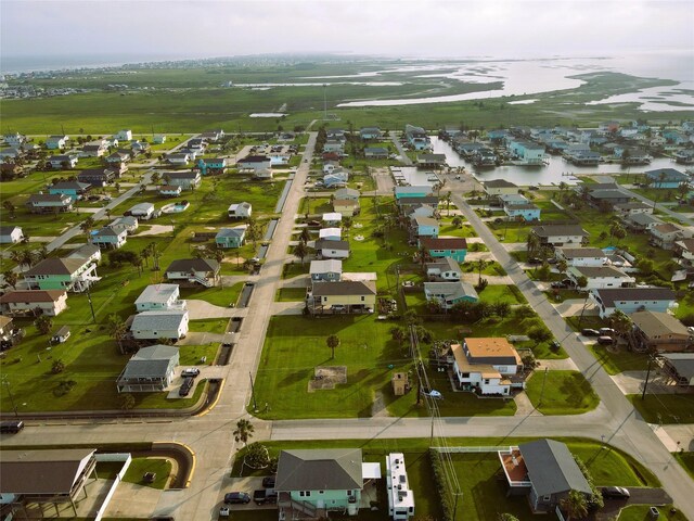 16611 Jolly Roger Rd, Jamaica Beach, TX 77554 - aerial view of property's location featuring nearby suburban area and a nearby body of water