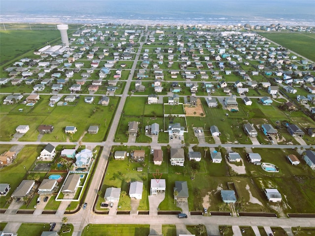 16611 Jolly Roger Rd, Jamaica Beach, TX 77554 - aerial overview of property's location with a large body of water and nearby suburban area