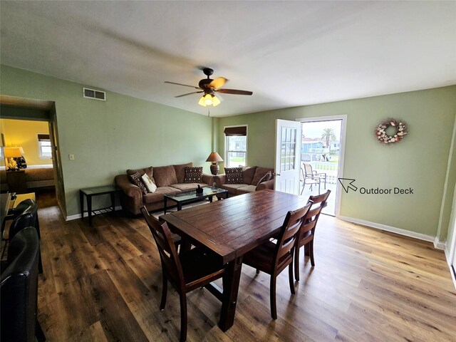 16611 Jolly Roger Rd, Jamaica Beach, TX 77554 - dining area featuring wood finished floors, ceiling fan, and baseboards