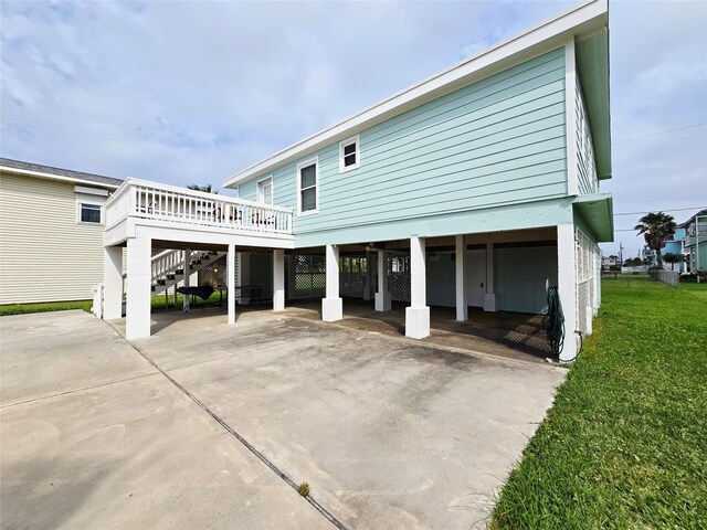 16611 Jolly Roger Rd, Jamaica Beach, TX 77554 - back of house featuring stairs, a deck, and a yard