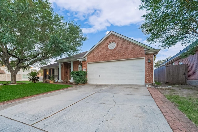 2403 Crescent Hollow Ct, Spring, TX 77388 - ranch-style home with brick siding, concrete driveway, and a garage