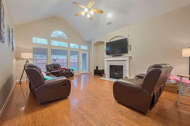 2403 Crescent Hollow Ct, Spring, TX 77388 - living area featuring a ceiling fan, wood finished floors, a tile fireplace, high vaulted ceiling, and baseboards