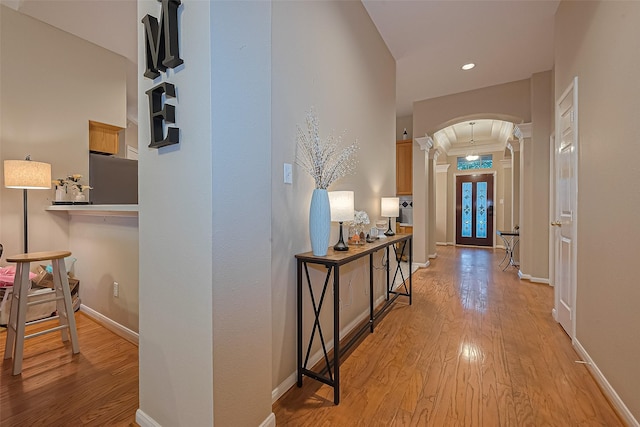 2403 Crescent Hollow Ct, Spring, TX 77388 - corridor featuring arched walkways, ornate columns, light wood finished floors, baseboards, and recessed lighting