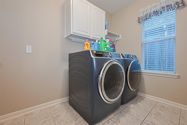 2403 Crescent Hollow Ct, Spring, TX 77388 - laundry room featuring separate washer and dryer, cabinet space, and baseboards
