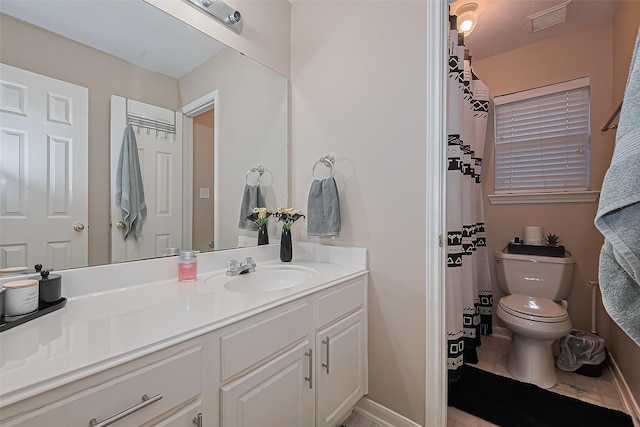 2403 Crescent Hollow Ct, Spring, TX 77388 - bathroom with vanity, toilet, and baseboards