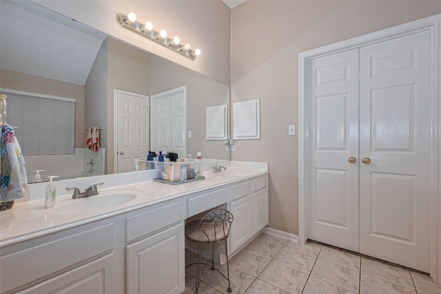 2403 Crescent Hollow Ct, Spring, TX 77388 - bathroom with double vanity, vaulted ceiling, and marble finish floors