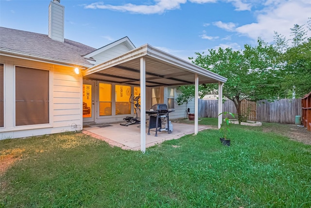 2403 Crescent Hollow Ct, Spring, TX 77388 - rear view of house with a patio, roof with shingles, and a chimney