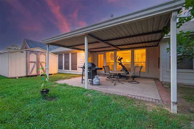 2403 Crescent Hollow Ct, Spring, TX 77388 - back of property at dusk featuring a patio, a lawn, and roof with shingles