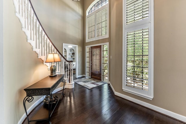 17718 Dove Tree Ln, Spring, TX 77379 - entrance foyer with healthy amount of natural light, hardwood / wood-style floors, baseboards, and a towering ceiling