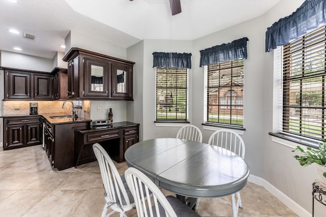 17718 Dove Tree Ln, Spring, TX 77379 - dining area with a ceiling fan, baseboards, and light tile patterned floors