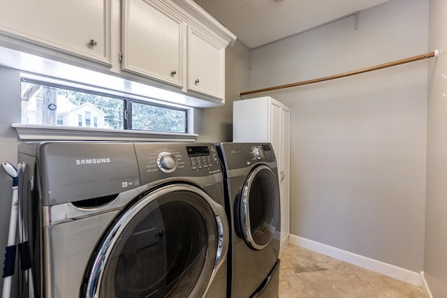 17718 Dove Tree Ln, Spring, TX 77379 - laundry area featuring washer and clothes dryer, cabinet space, and baseboards
