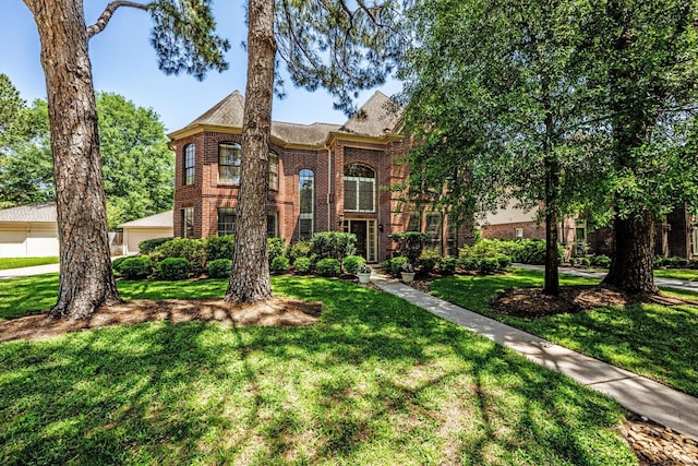 17718 Dove Tree Ln, Spring, TX 77379 - view of front of home with brick siding and a front yard