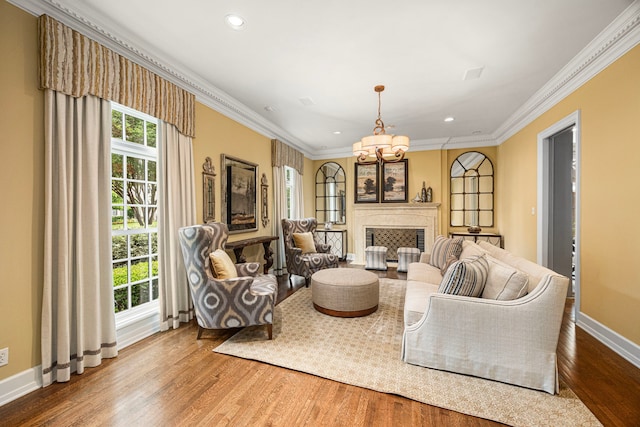 5567 Longmont Dr, Houston, TX 77056 - living area with wood finished floors, ornamental molding, baseboards, recessed lighting, and a chandelier
