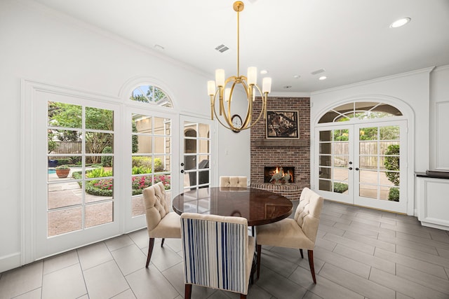 5567 Longmont Dr, Houston, TX 77056 - dining area with french doors, ornamental molding, healthy amount of natural light, light tile patterned floors, and a chandelier