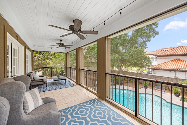 5567 Longmont Dr, Houston, TX 77056 - sunroom featuring outdoor lounge area, track lighting, and ceiling fan