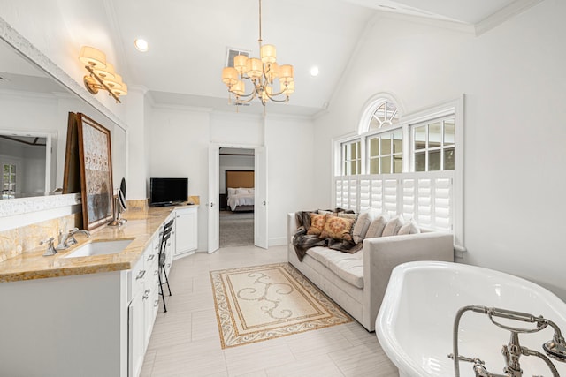 5567 Longmont Dr, Houston, TX 77056 - ensuite bathroom with a freestanding bath, a chandelier, vanity, ornamental molding, and high vaulted ceiling