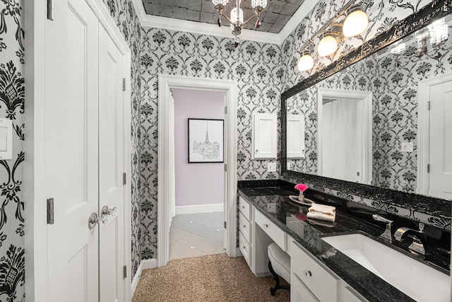 5567 Longmont Dr, Houston, TX 77056 - full bathroom featuring wallpapered walls, double vanity, a chandelier, baseboards, and ornamental molding