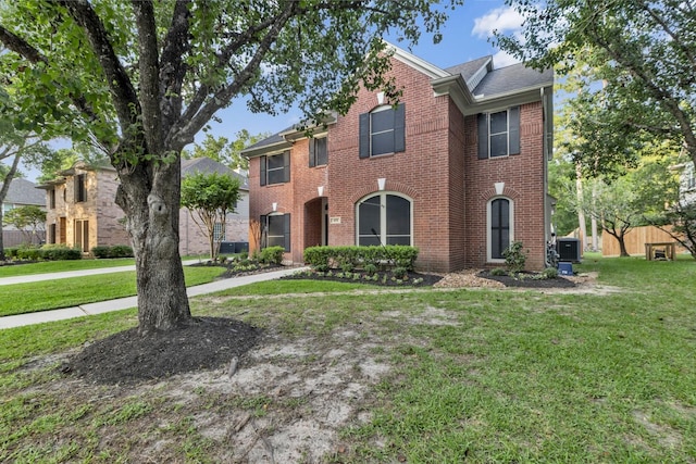 4531 Mulberry Park Ln, Houston, TX 77345 - traditional-style home featuring brick siding and a front lawn