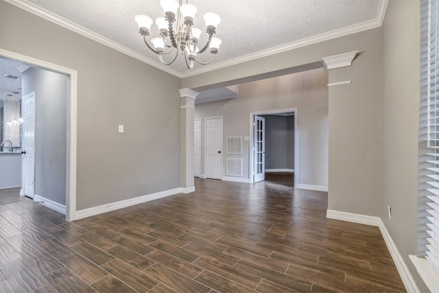 4531 Mulberry Park Ln, Houston, TX 77345 - empty room with baseboards, dark wood finished floors, a chandelier, a textured ceiling, and decorative columns