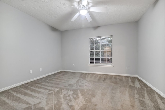4531 Mulberry Park Ln, Houston, TX 77345 - carpeted empty room featuring a textured ceiling, a ceiling fan, and baseboards