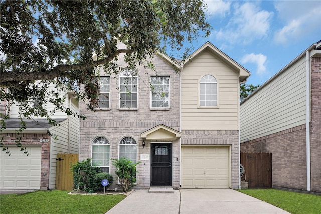 10239 W Palm Lake Dr, Houston, TX 77034 - view of front of property with driveway, fence, brick siding, and an attached garage