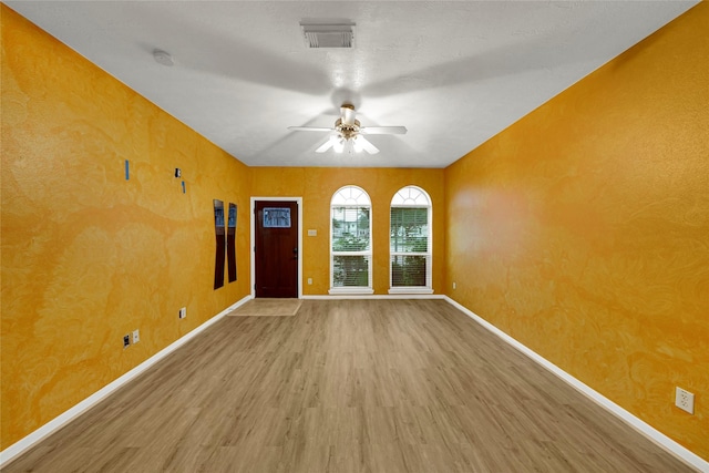 10239 W Palm Lake Dr, Houston, TX 77034 - unfurnished room with wood finished floors, ceiling fan, baseboards, and a smoke detector