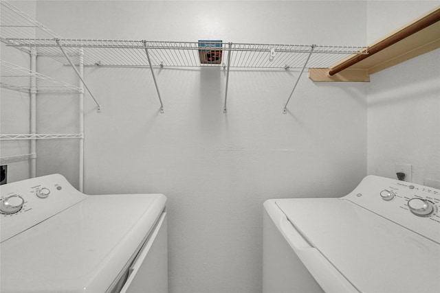10239 W Palm Lake Dr, Houston, TX 77034 - laundry room with washer and clothes dryer