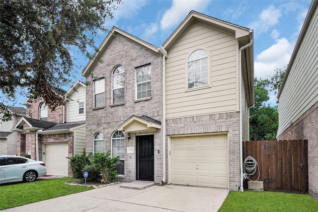10239 W Palm Lake Dr, Houston, TX 77034 - view of front facade with driveway, fence, brick siding, and an attached garage