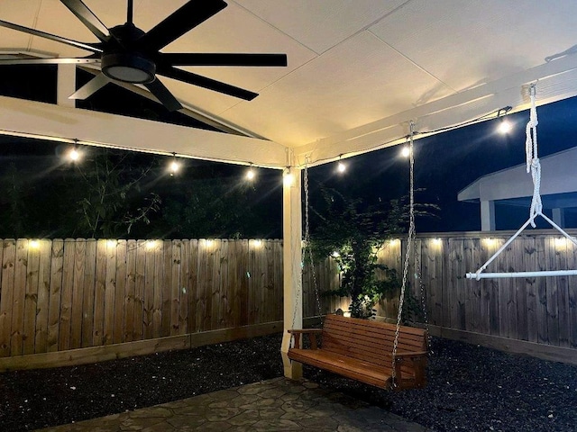 10239 W Palm Lake Dr, Houston, TX 77034 - patio at twilight featuring ceiling fan and a fenced backyard