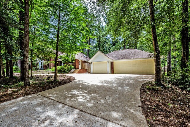 1967 Greentree Dr, Huntsville, TX 77340 - view of front of house with concrete driveway
