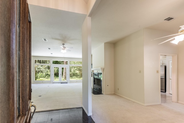 1967 Greentree Dr, Huntsville, TX 77340 - hallway featuring carpet, baseboards, and tile patterned flooring
