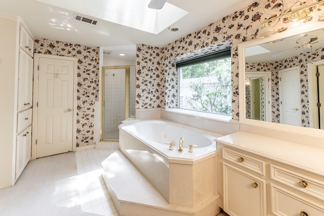 1967 Greentree Dr, Huntsville, TX 77340 - bathroom with wallpapered walls, a skylight, a shower stall, and a tub with jets