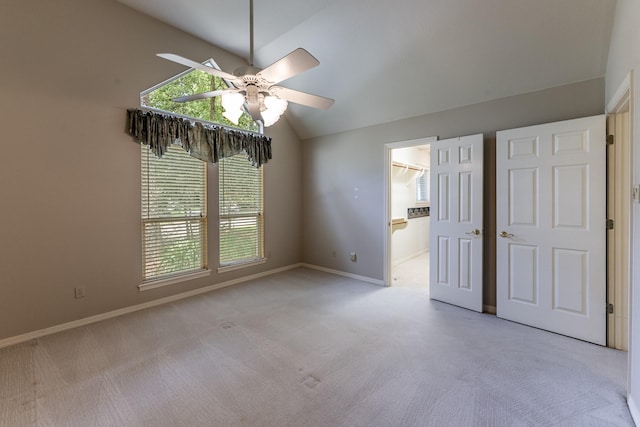 1967 Greentree Dr, Huntsville, TX 77340 - unfurnished bedroom featuring vaulted ceiling, carpet, multiple windows, and baseboards