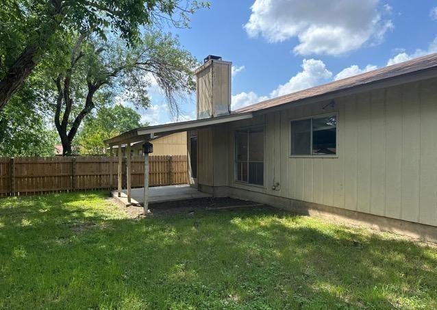 4735 El Vedado St, San Antonio, TX 78233 - rear view of property with a chimney and a patio