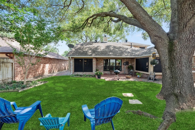 16310 Leamington Ln, Houston, TX 77095 - rear view of property with brick siding, a patio area, a chimney, and roof with shingles