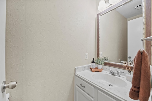 16310 Leamington Ln, Houston, TX 77095 - bathroom with a textured wall and vanity